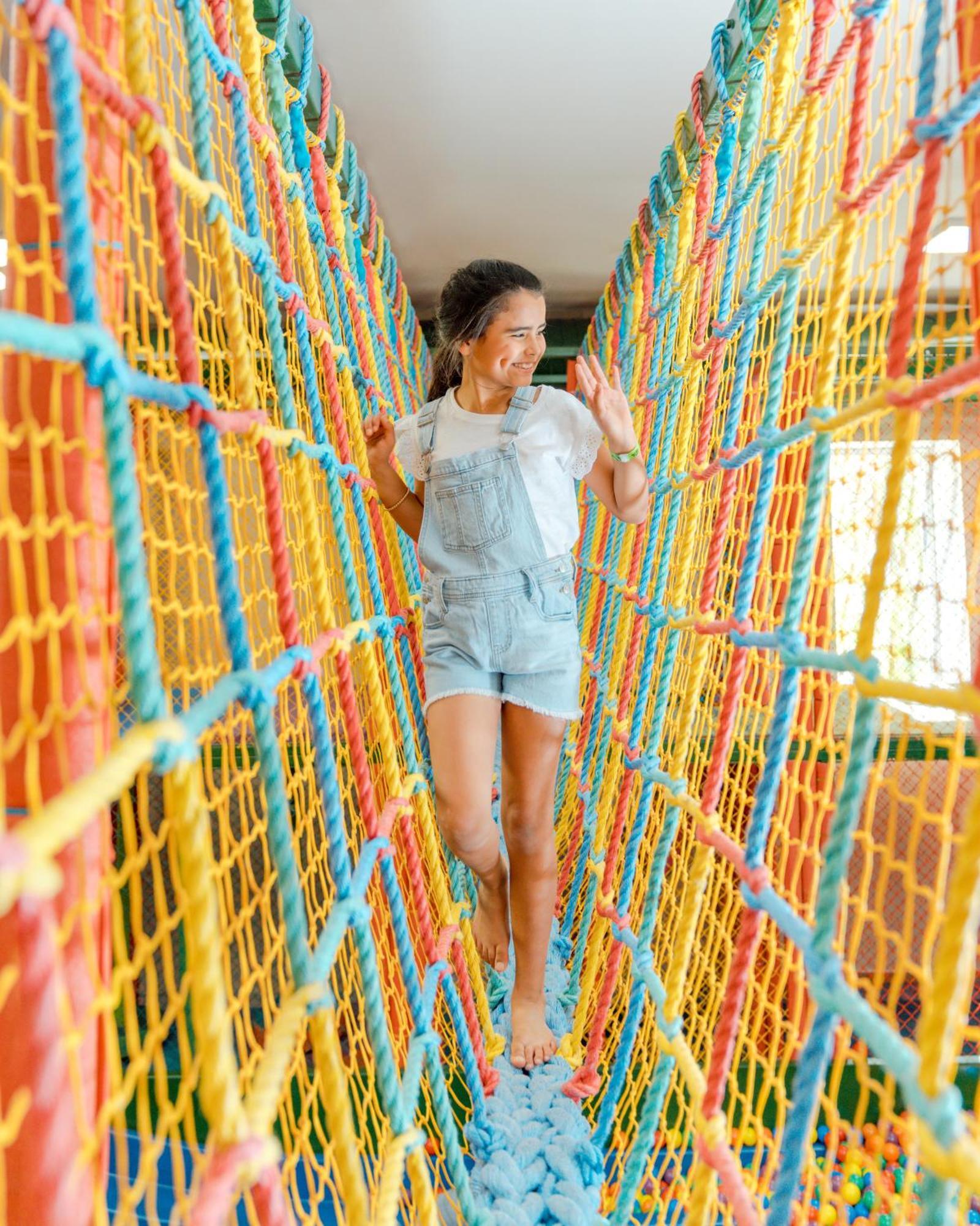 Hard Rock Hotel & Casino Punta Cana (Adults Only) Екстериор снимка A girl walking on a rope bridge